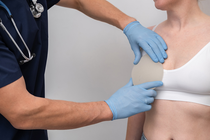 Doctor testing implant against patient’s body