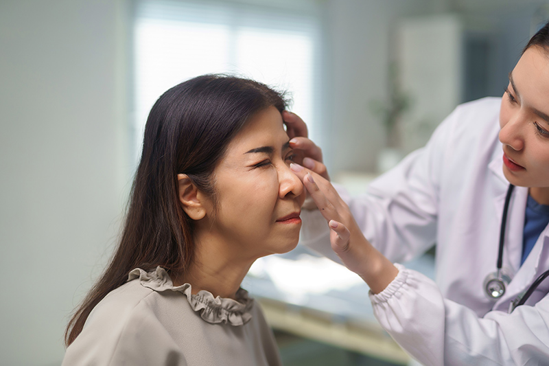 A doctor providing a plastic surgery consultation