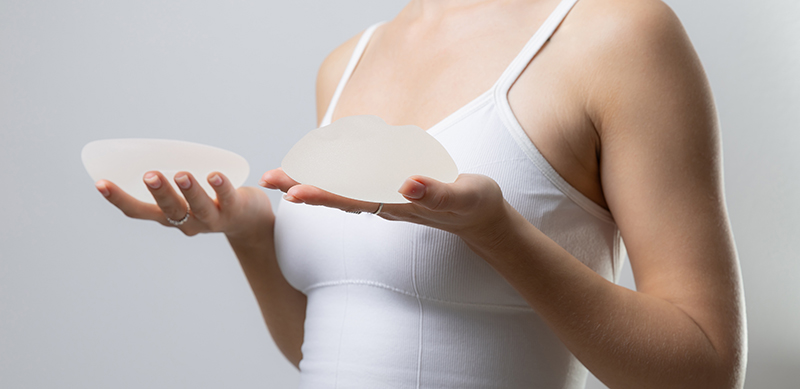 A woman considering revisions for breast implants