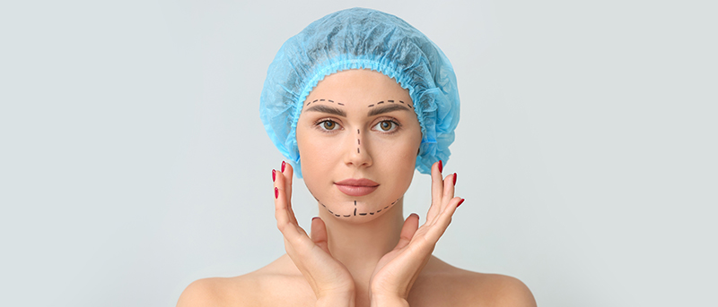 A plastic surgeon planning out a procedure for a patient